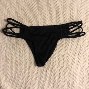Strappy, cheeky black bottoms